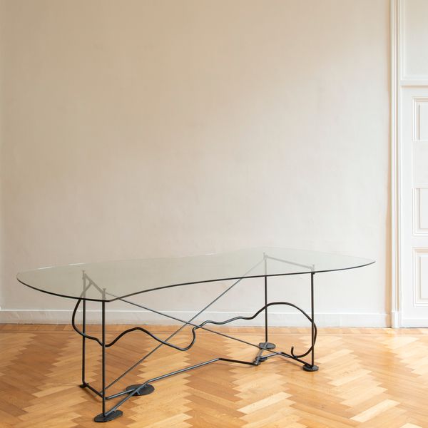 Artisan-made sculptural table In Steel & Glass