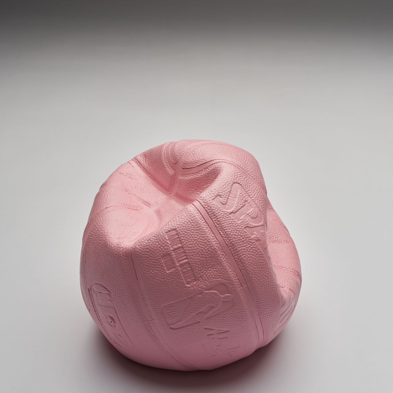 Deflated Basketball Bookend by The Pink Lemonade | Basic.Space