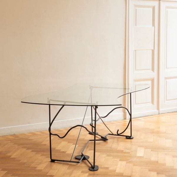Artisan-made sculptural table In Steel & Glass